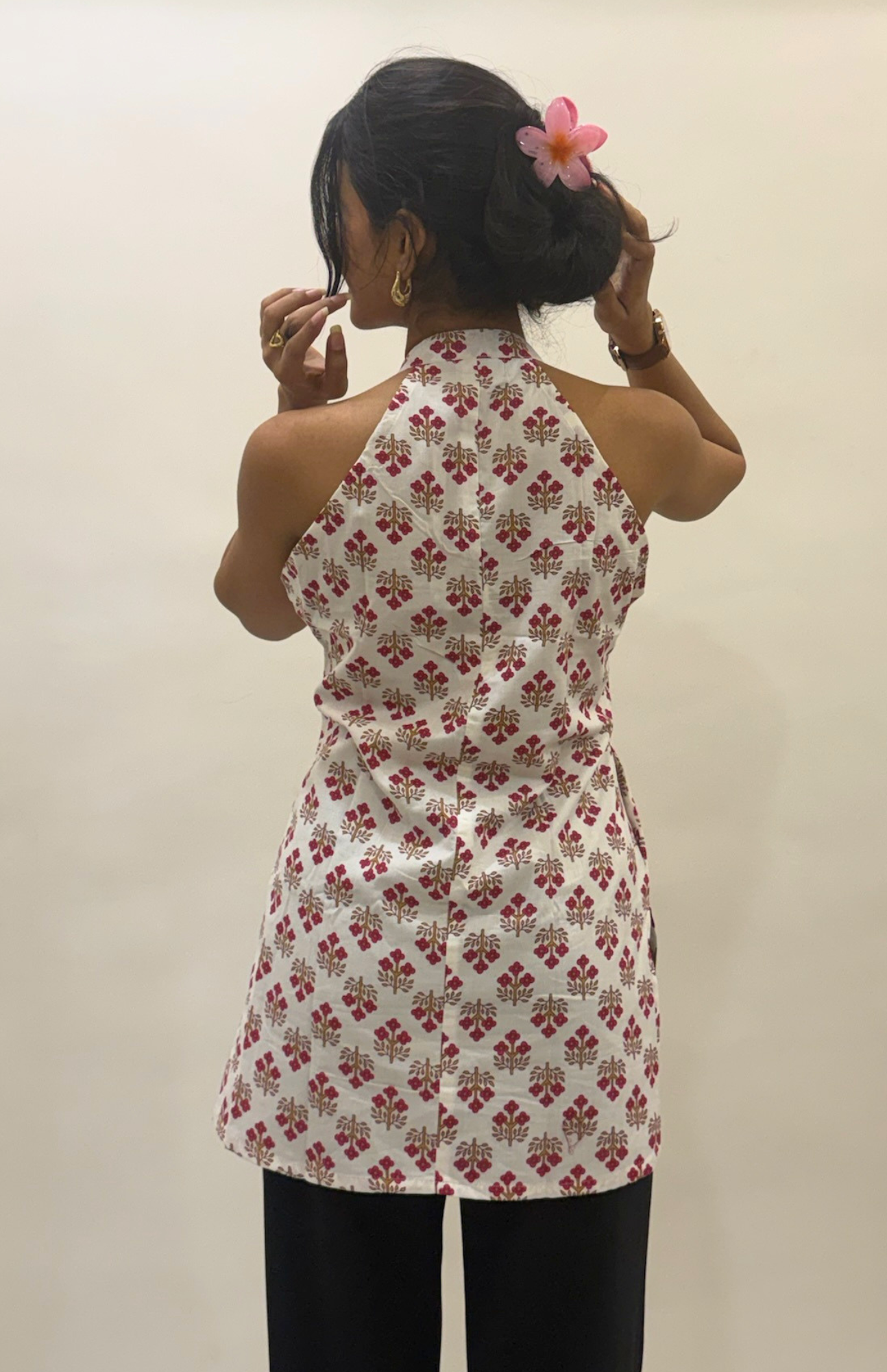 Back design of white floral cotton halter neck short kurti for women