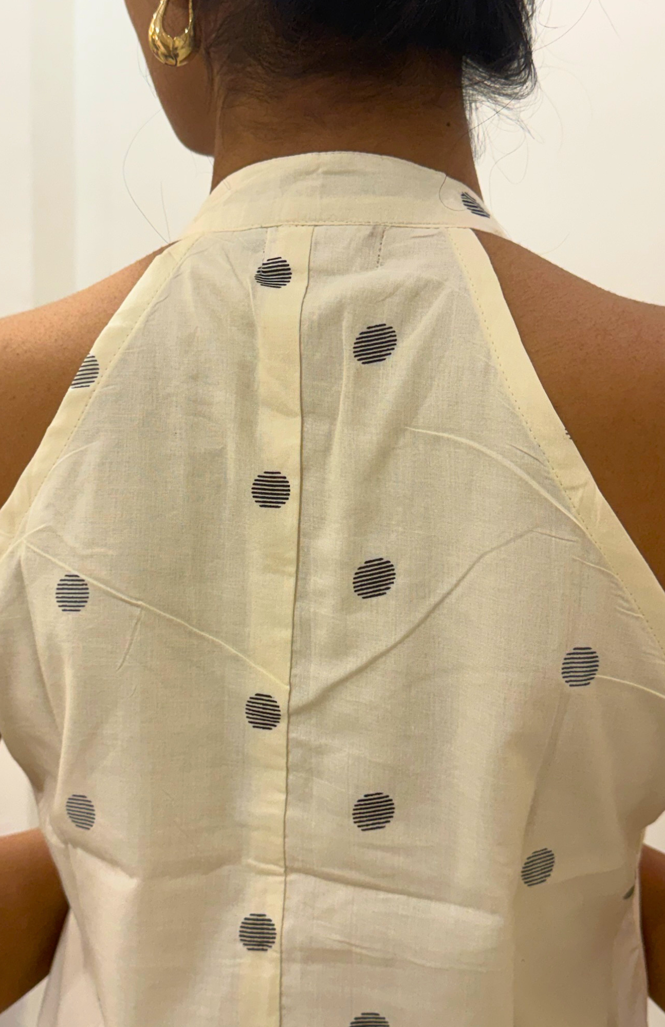 Back design of cream halter neck cotton kurti