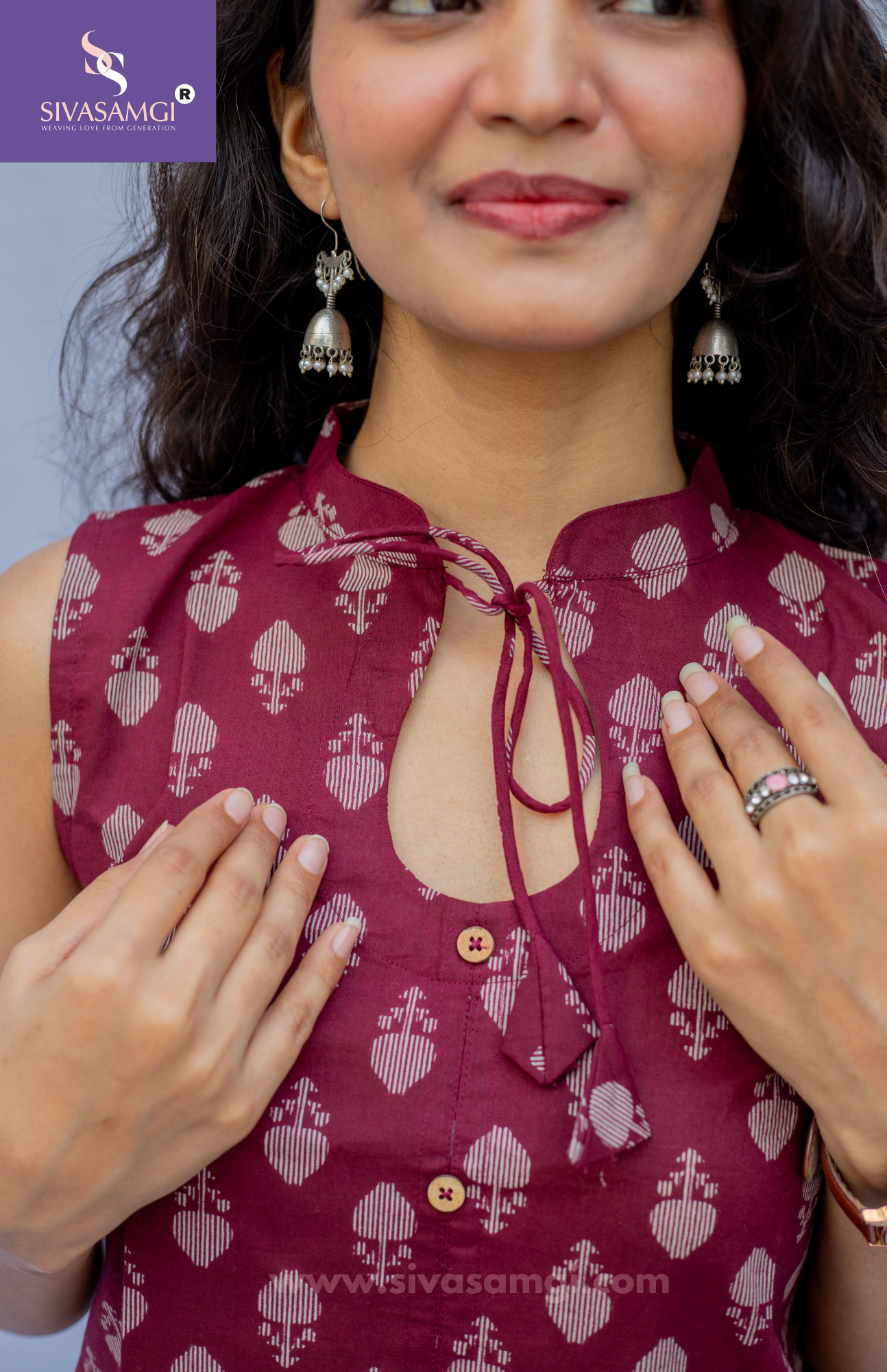 Closeup of mandarin collar butti print cotton top with wooden buttons