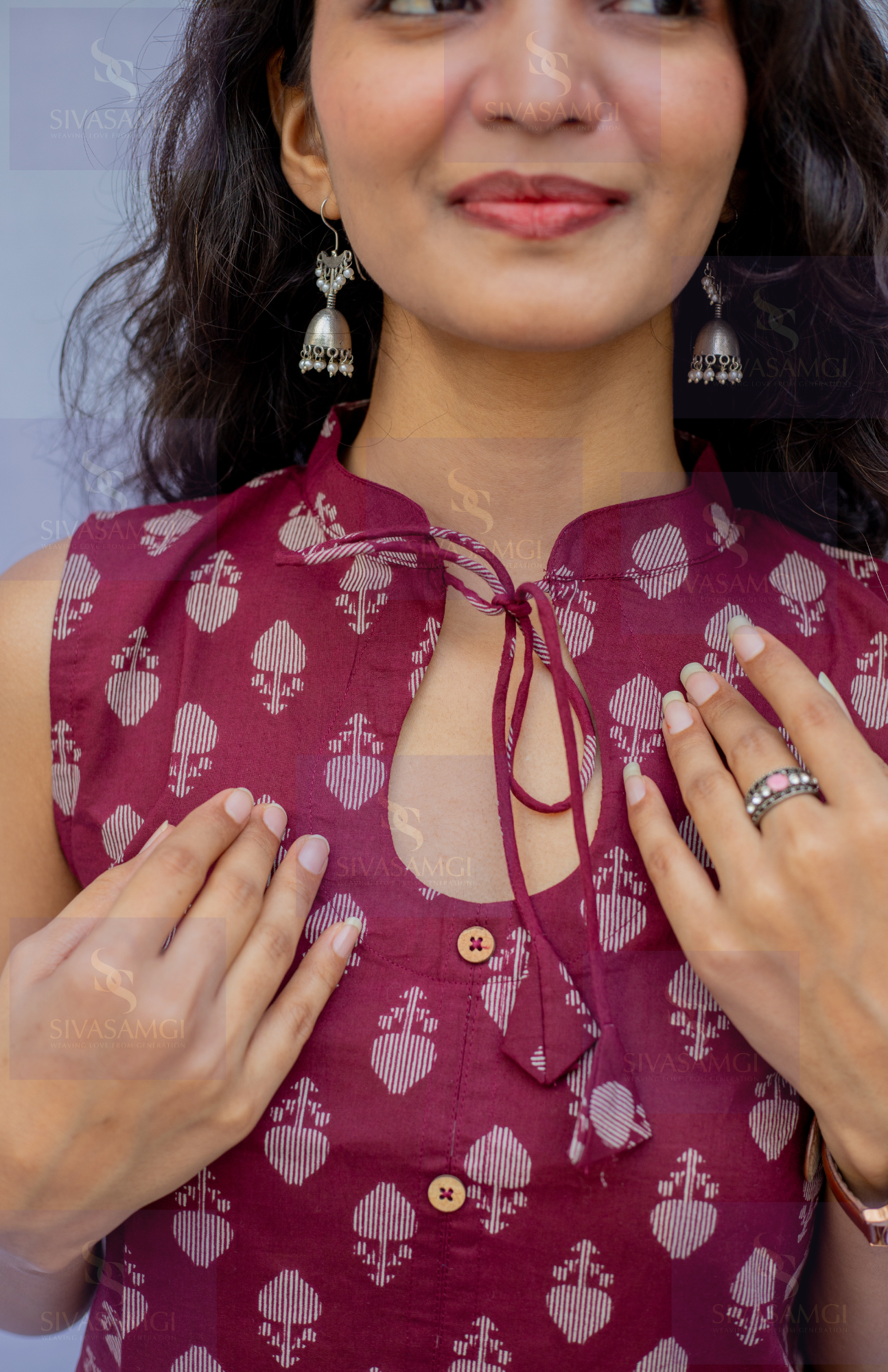 Closeup of mandarin collar butti print cotton top with wooden buttons