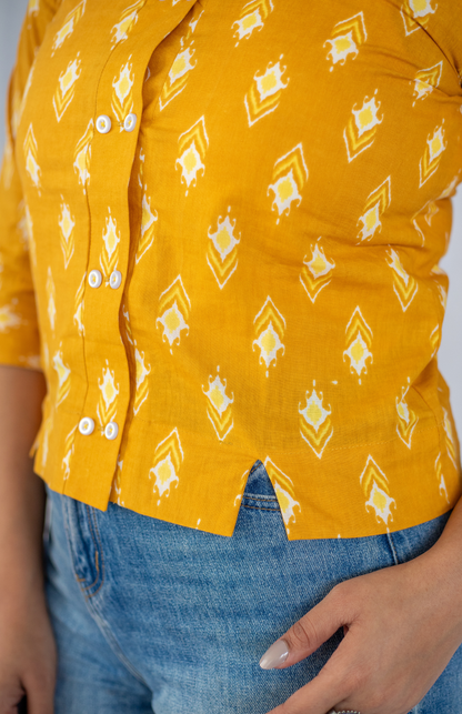 mustard ikat cotton shirt fabric close up
