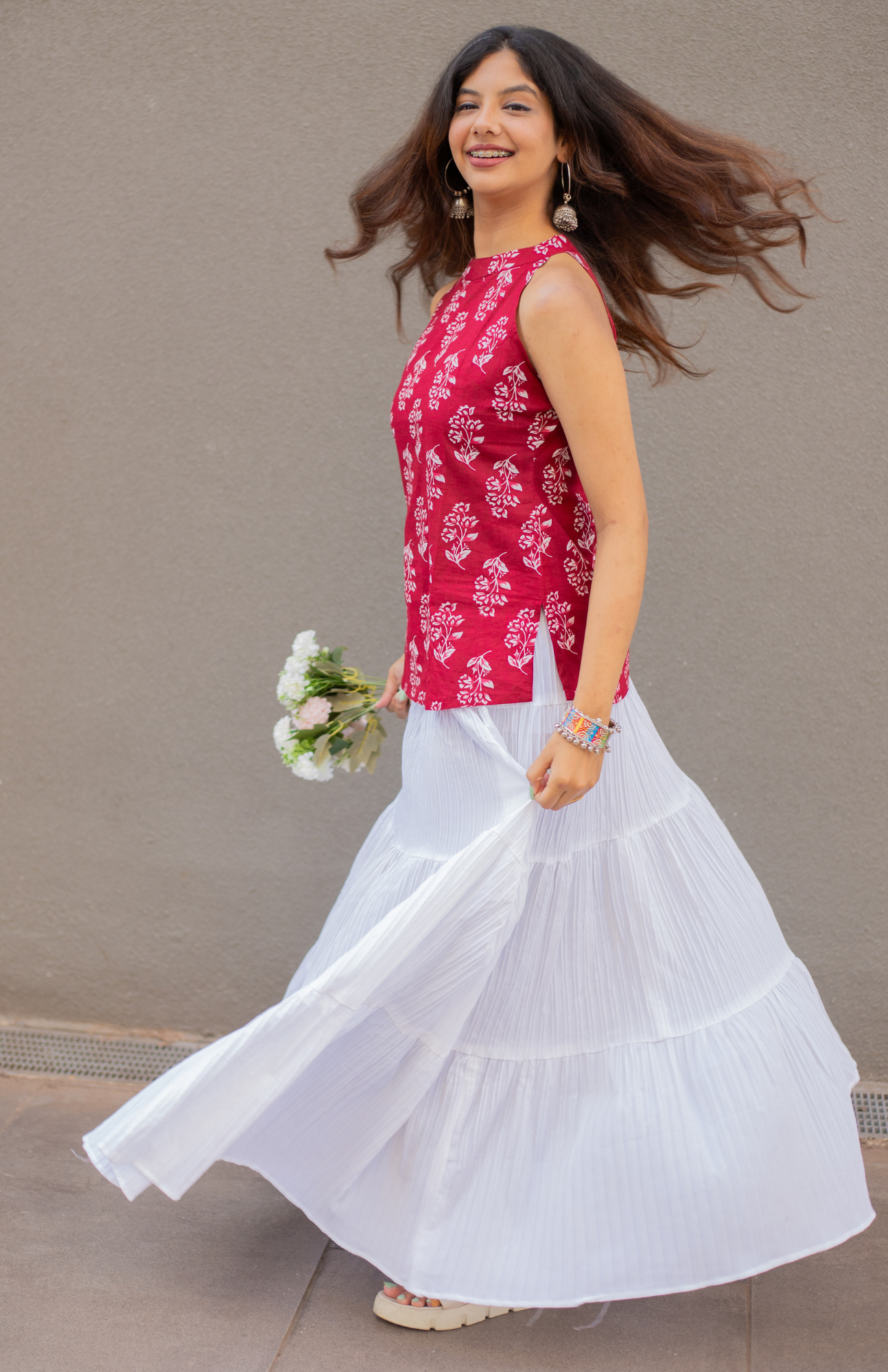 maroon halter neck cotton top paired with white skirt