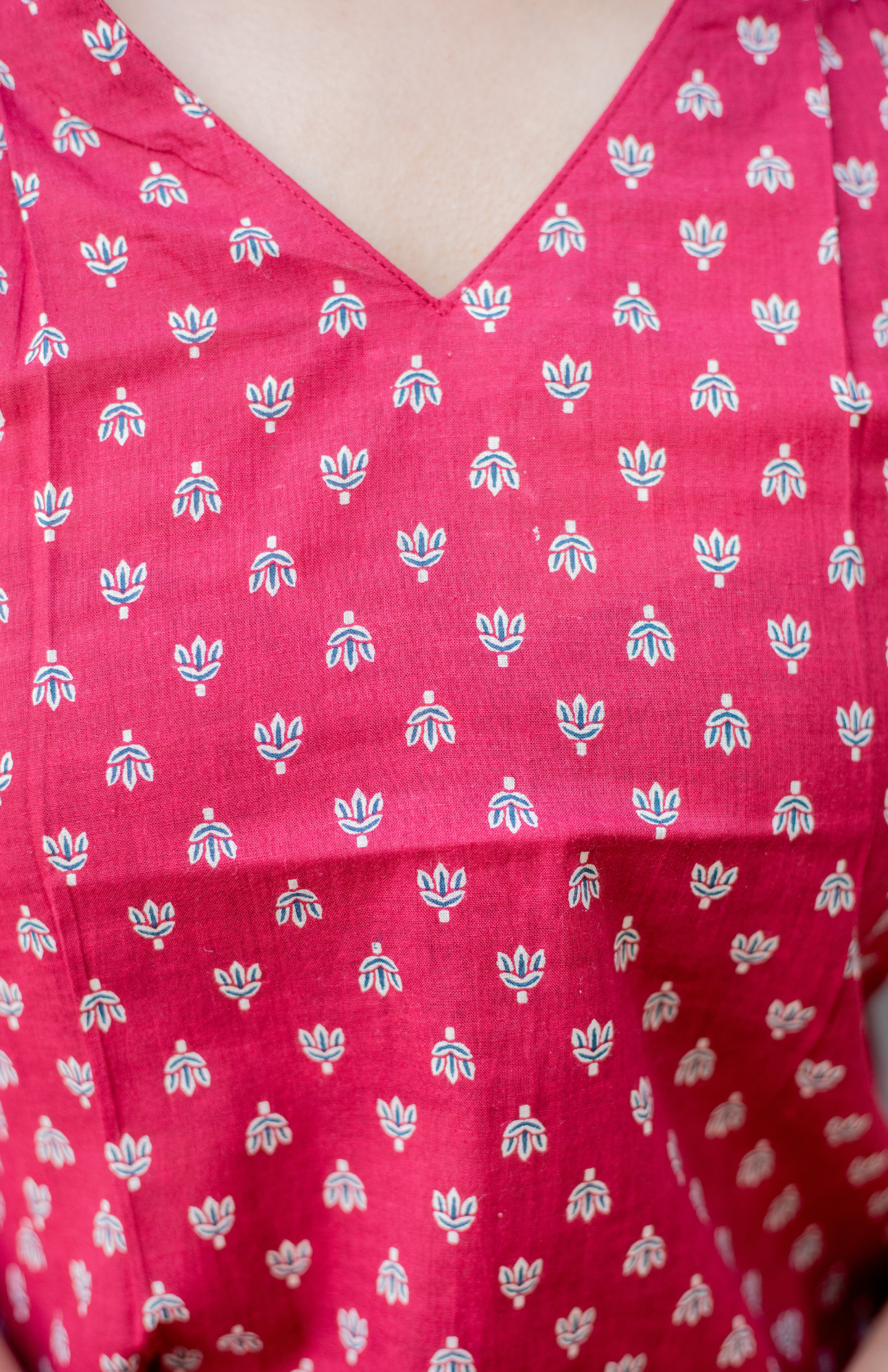 Maroon garment with white floral pattern