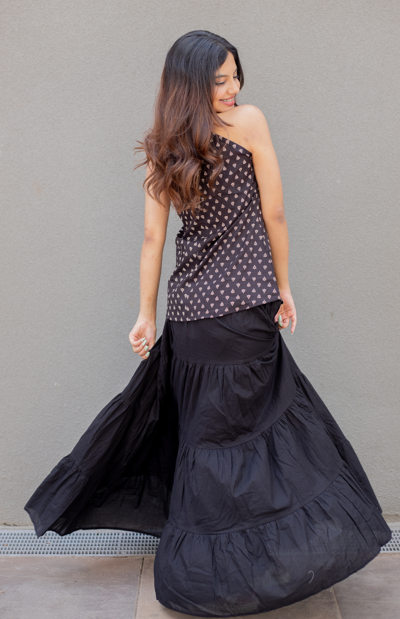 Black Butti Print V Neck Halter Neck Cotton Top paired with black skirt